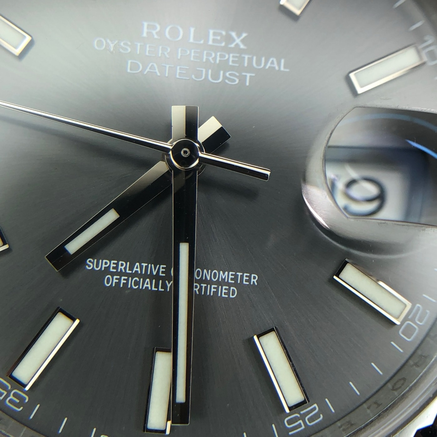 Applied markers and pressed dial lettering